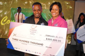 Alrick Parris poses with Gillian Hyde, General Manager of JN Small Business Loans after finishing second at the JNSBL Barber and Beauty Battle and Expo held at the Jamaica Pegasus Hotel in 2015. 