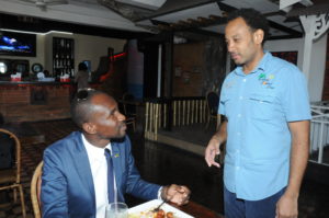 Maurice Harding (left) compliments Island Squeez Diner/CruiserZ Lounge’s owner Kevin Pearson on the service after lunch at the location.