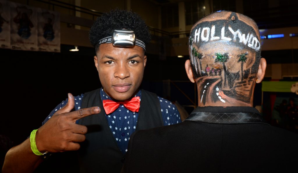 Damayo Riley shows off his barber art during the Hollywood Showtime Category of the JNSBL Barber and Beauty Battle last year.